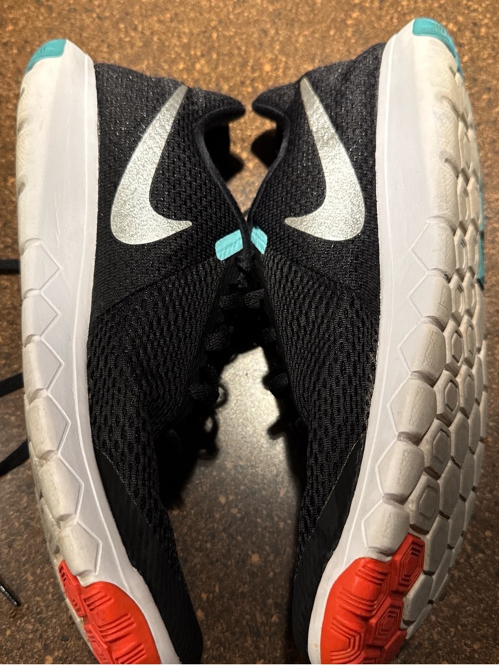 Nike Women's Black Running Shoes with White Swoosh and Teal Accents